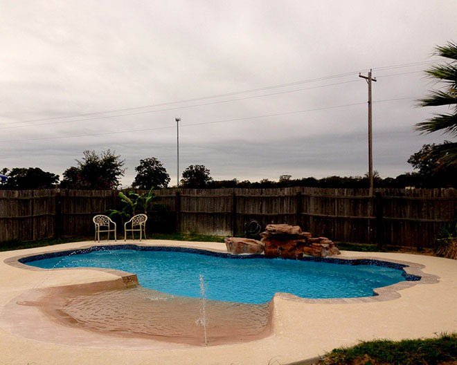 fiberglass pool with beach front entry